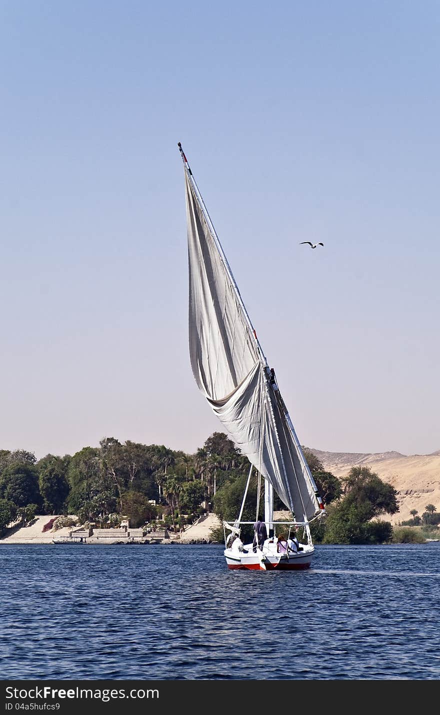 Sailboat with tourists going to Botanical Garden, Aswan, Egypt. Sailboat with tourists going to Botanical Garden, Aswan, Egypt.