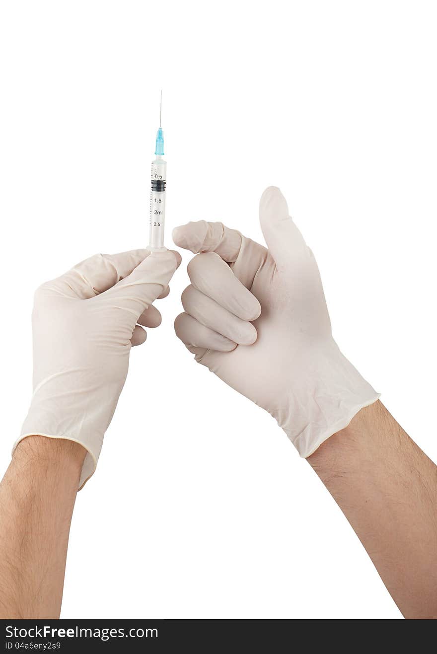 Doctor hands with gloves holding syringe