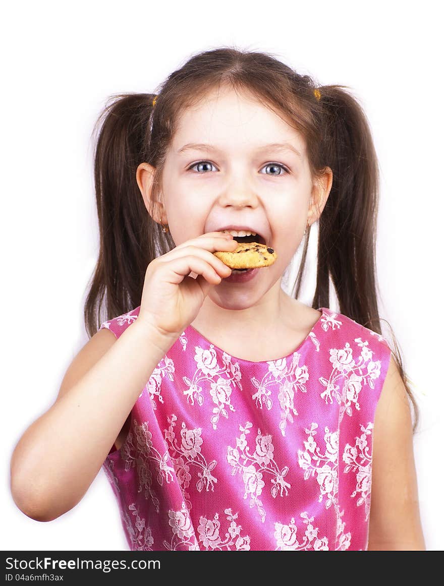 Little pretty girl eating cookie, over white. Little pretty girl eating cookie, over white