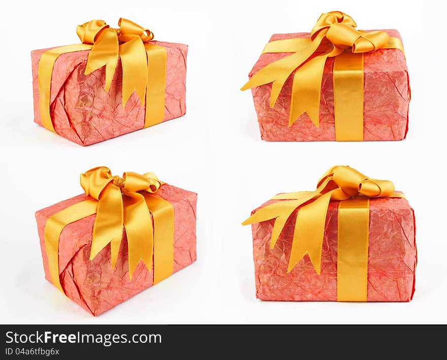 Single red gift box with yellow ribbon on white background