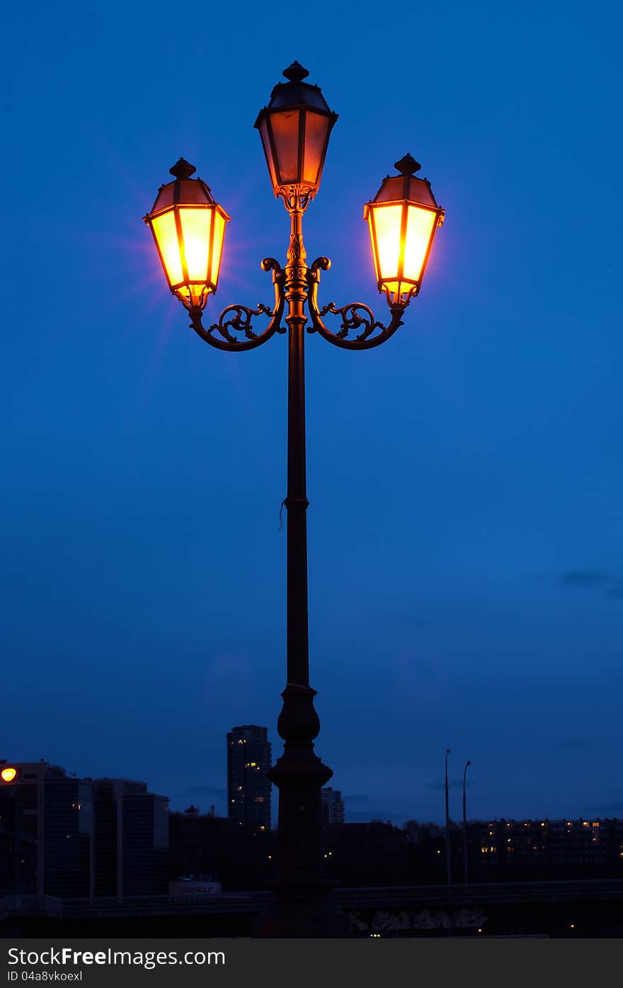 City lamp light at night, and blue sky. City lamp light at night, and blue sky