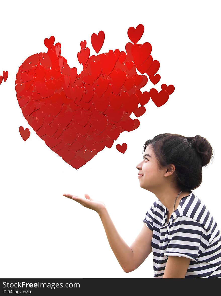 Romantic young woman holding a big heart composed of small red hearts in hands. Romantic young woman holding a big heart composed of small red hearts in hands