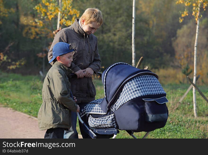 Mother with kids walking in the park