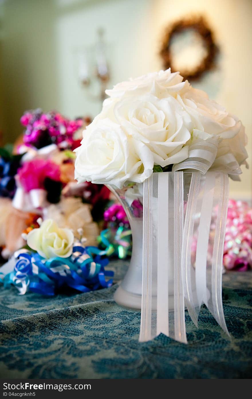 A white rose wedding bouquet in a vase of water