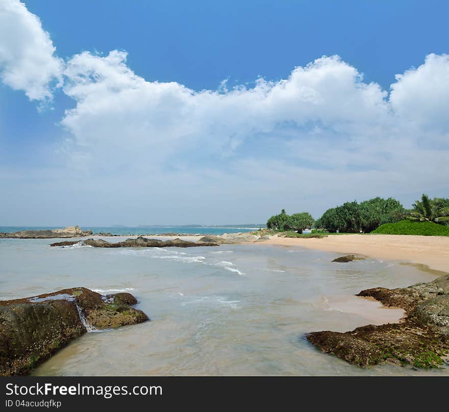 Beautiful stones in the waves on ocean coast