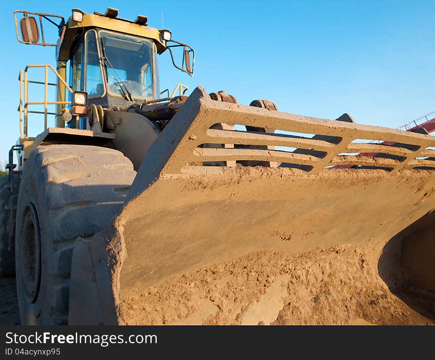 Earth moving digger in a gravel pit.