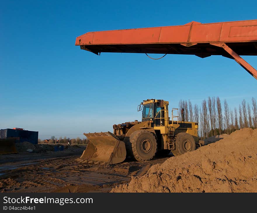 Earth moving digger in a quarry