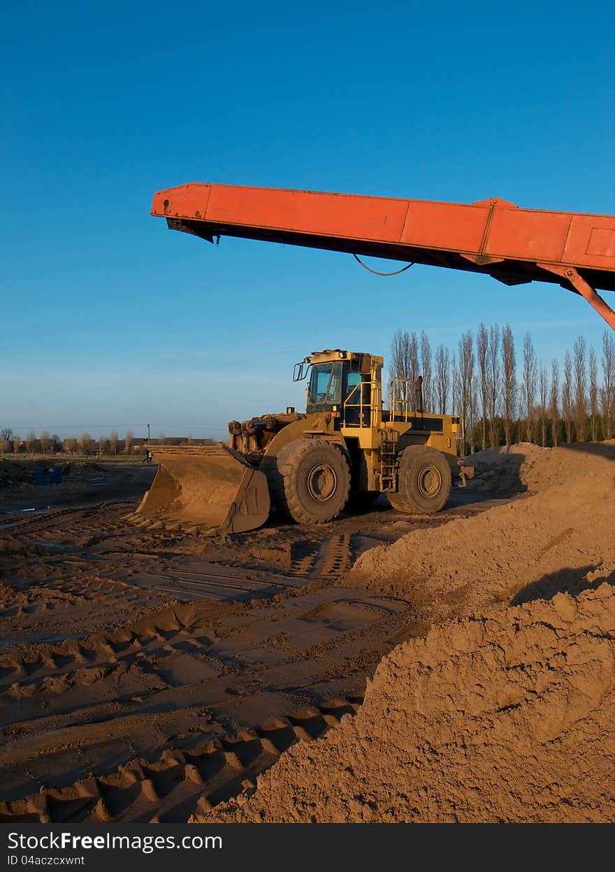 Earth moving digger in a quarry