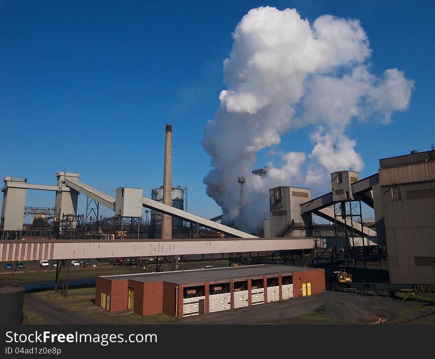 Industrial chimneys billowing steam. Industrial chimneys billowing steam.