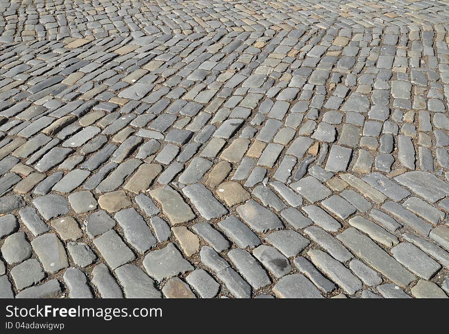 Old pavement, historic cobbles, and background. Old pavement, historic cobbles, and background.