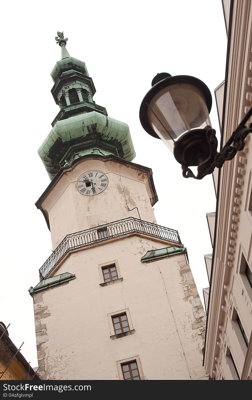 The Tower on Michal Gate (slovak: Michalska brana) and an ancient street lamp. Bratislava, Slovak republic. The Tower on Michal Gate (slovak: Michalska brana) and an ancient street lamp. Bratislava, Slovak republic.