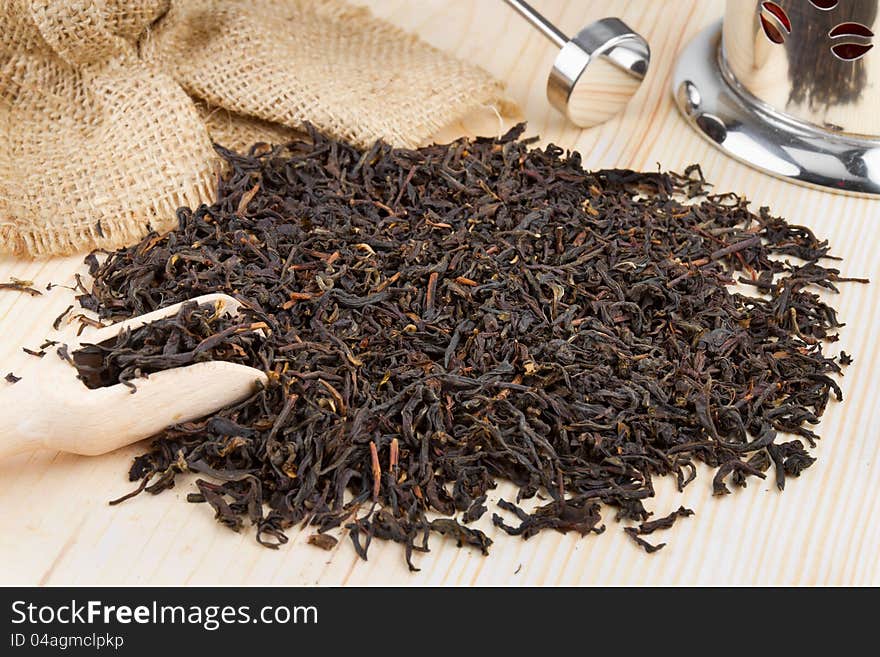 Black Tea Pile, Wooden Scoop, Teapot