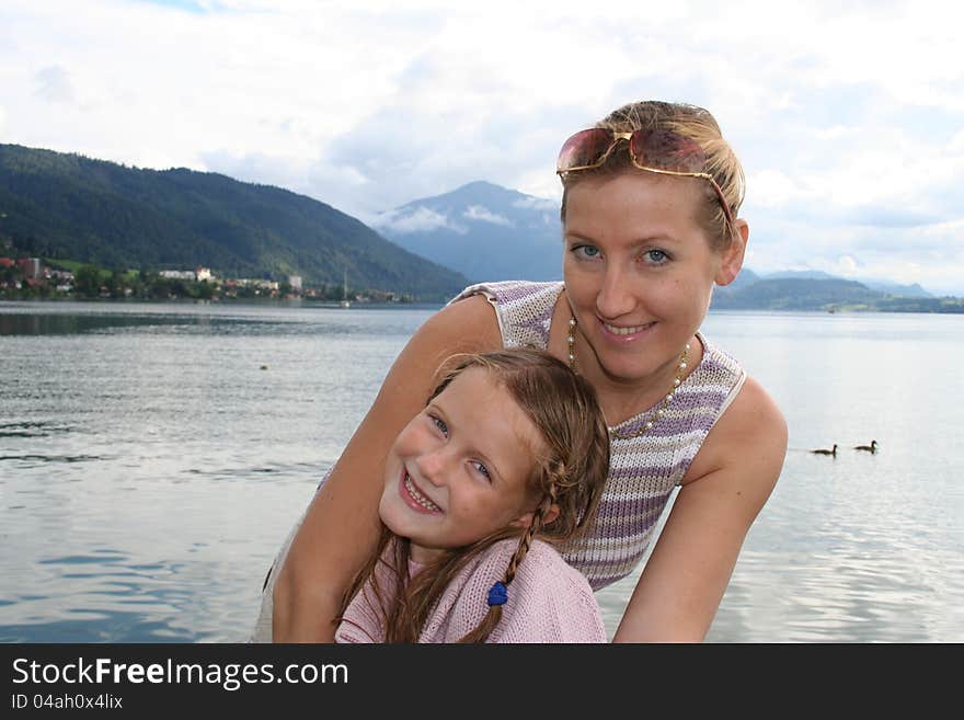 Beauty young mother with her daughter on the swisslake. Beauty young mother with her daughter on the swisslake