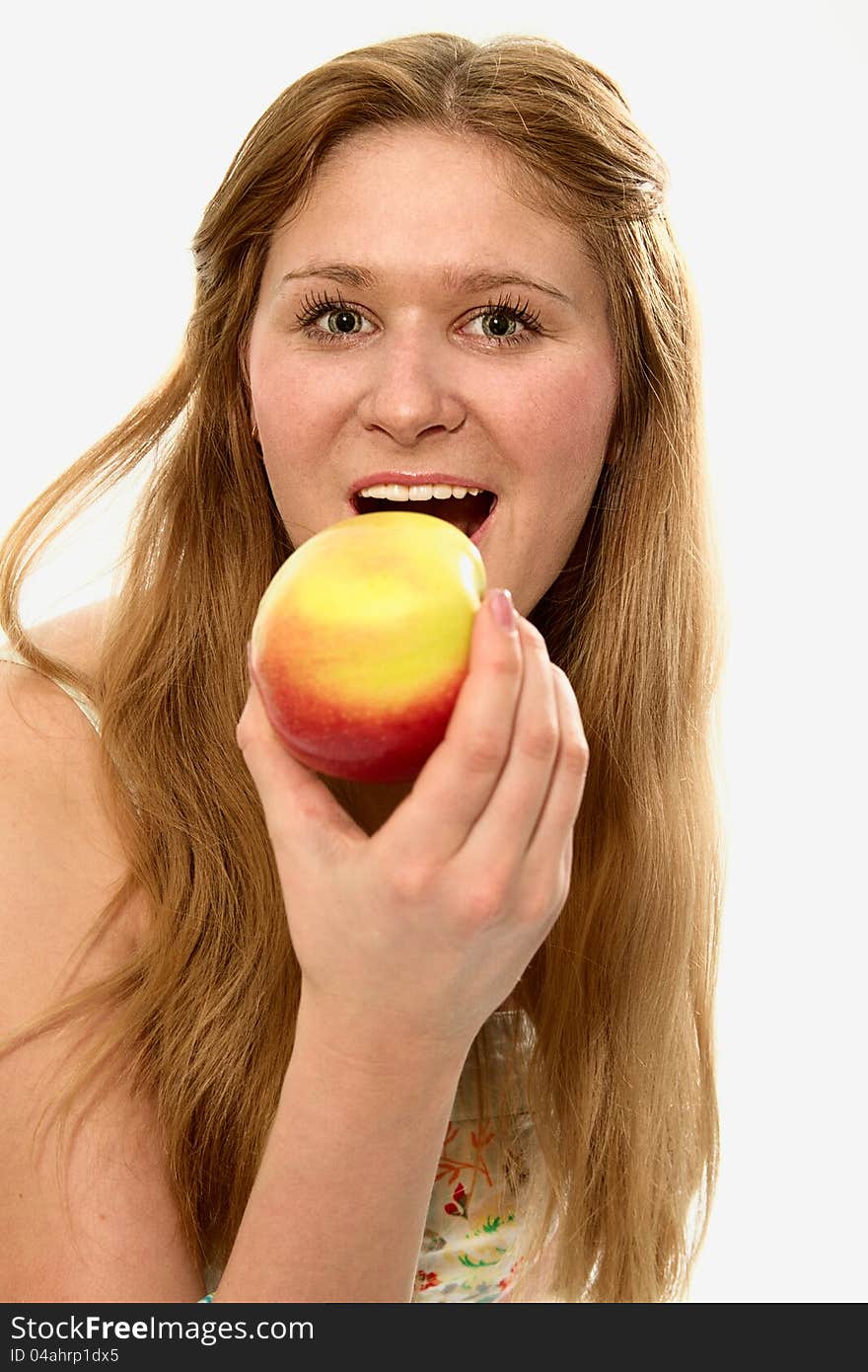 A young girl with an apple in her hand