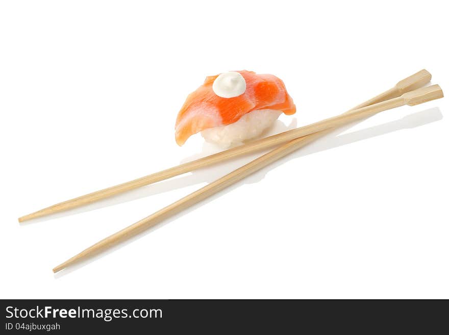 Wooden chopsticks and sushi isolated on a white background