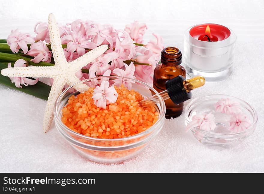 Relaxing and beautiful spa still life with candles, flowers and bath salts. Relaxing and beautiful spa still life with candles, flowers and bath salts.