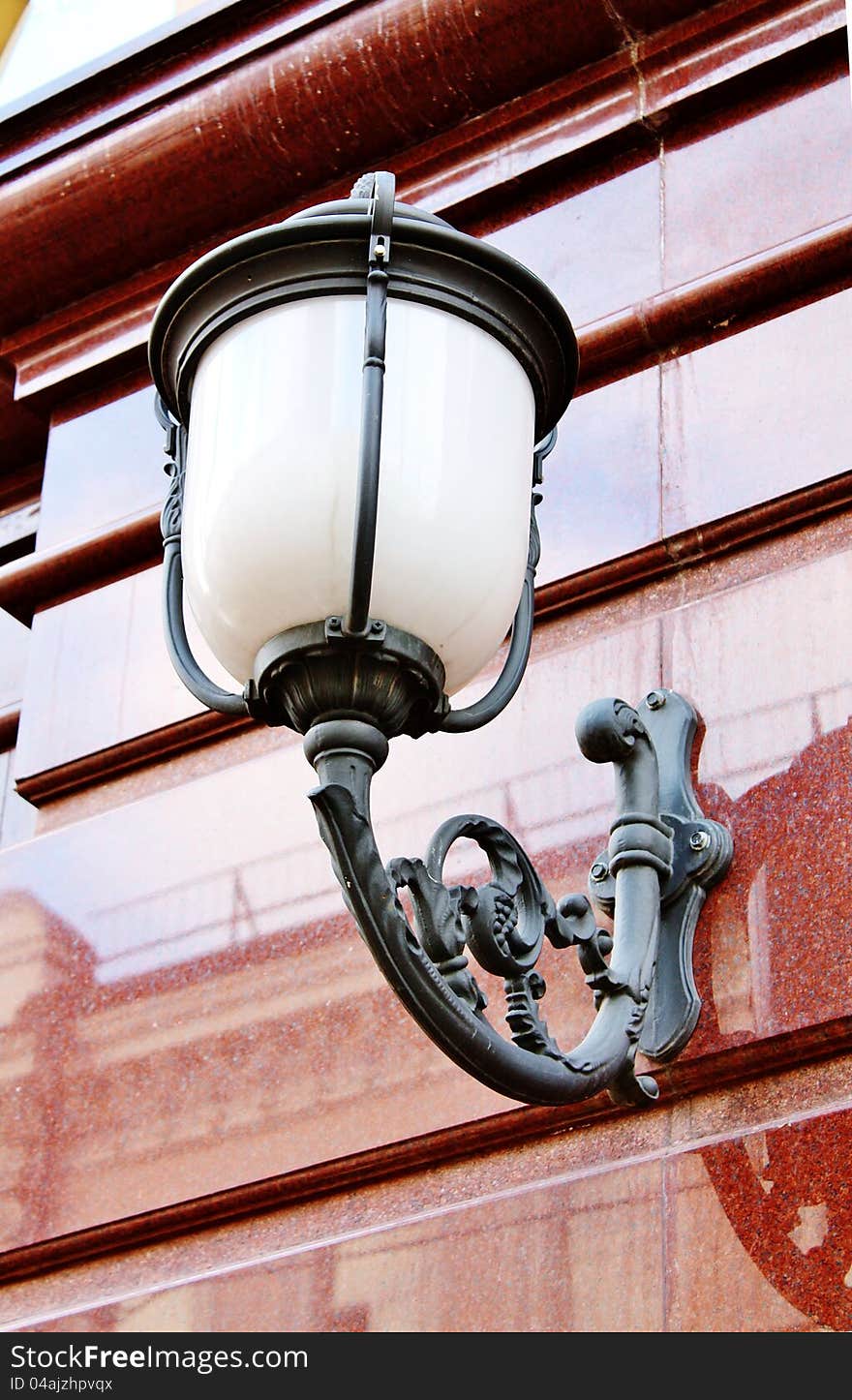 Black vintage street lamp  on the brown wall. Black vintage street lamp  on the brown wall