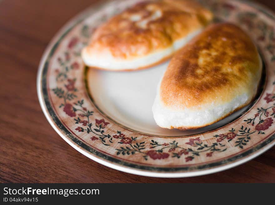 Two Pie With Meat On A Plate