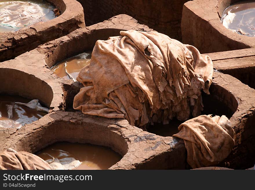 Tradtional old way of dyeing leather, tanneries, Fes, Morocco. Tradtional old way of dyeing leather, tanneries, Fes, Morocco