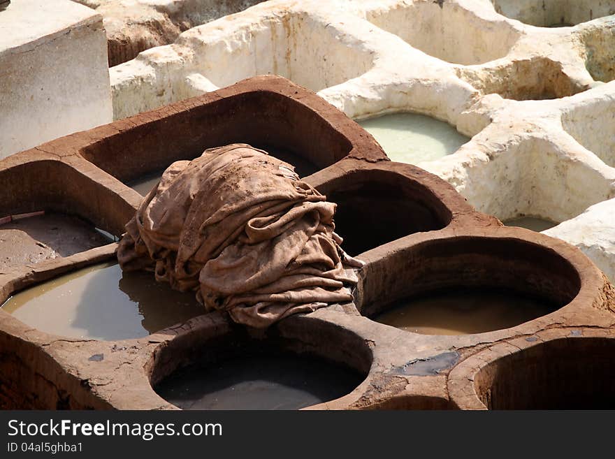 Tradtional old way of dyeing leather, tanneries, Fes, Morocco. Tradtional old way of dyeing leather, tanneries, Fes, Morocco