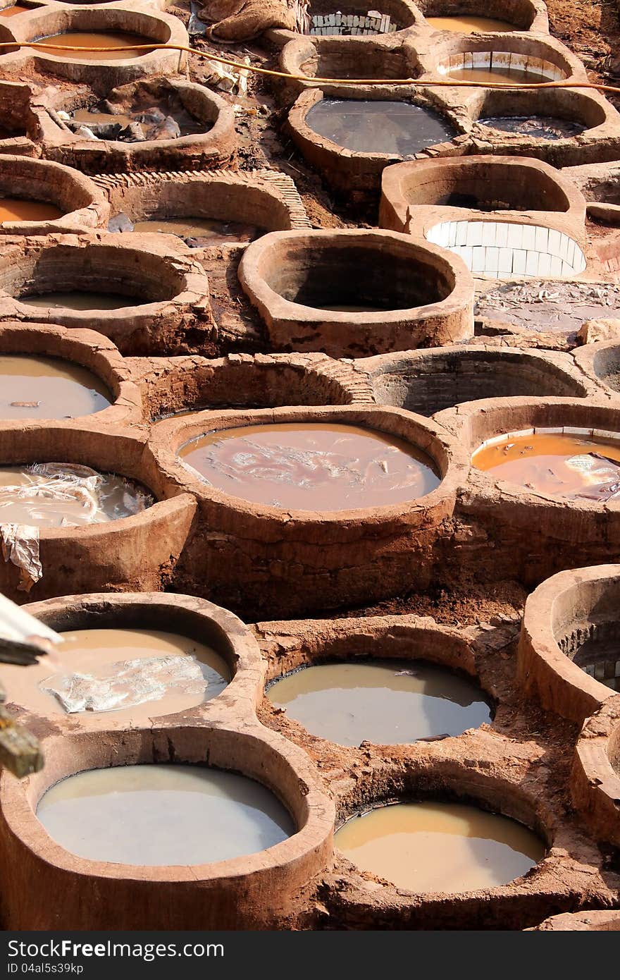 Tradtional old way of dyeing leather, tanneries, Fes, Morocco. Tradtional old way of dyeing leather, tanneries, Fes, Morocco