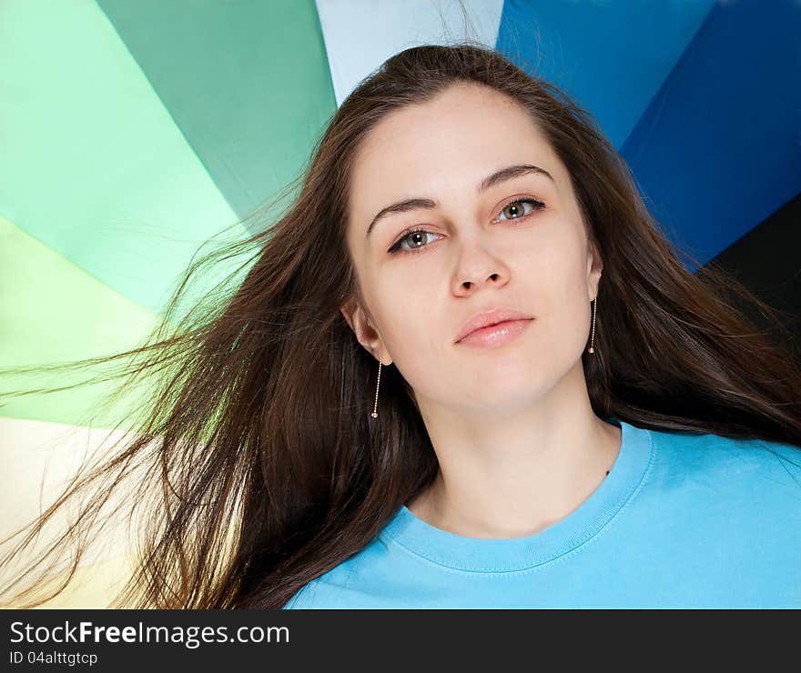 Portrait of beautiful woman with colorful umbrella