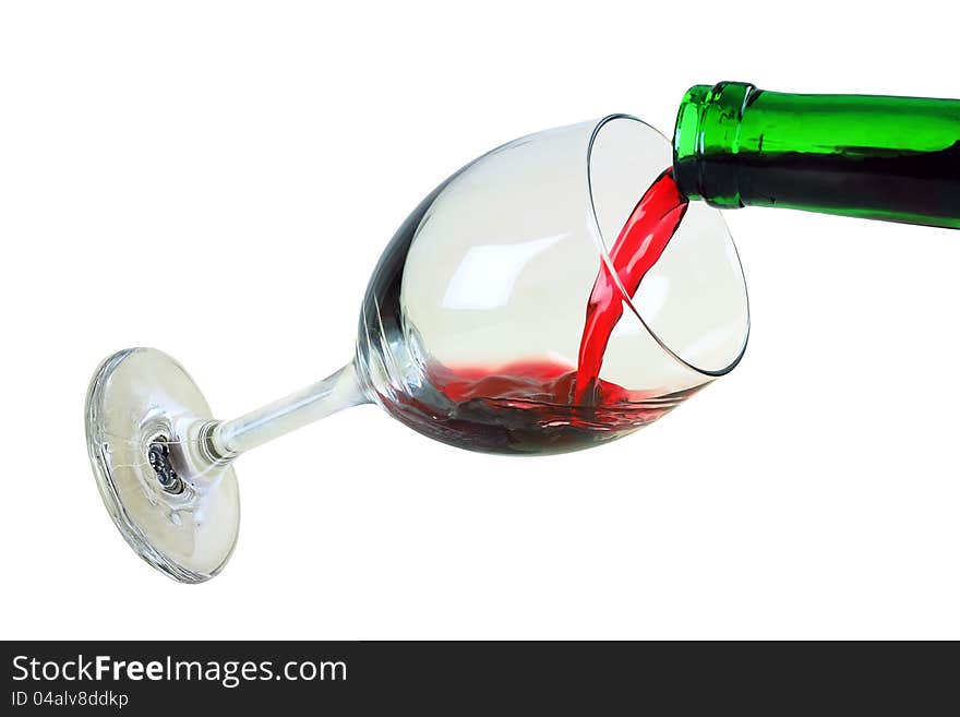 The glass with red wine is isolated on a white background