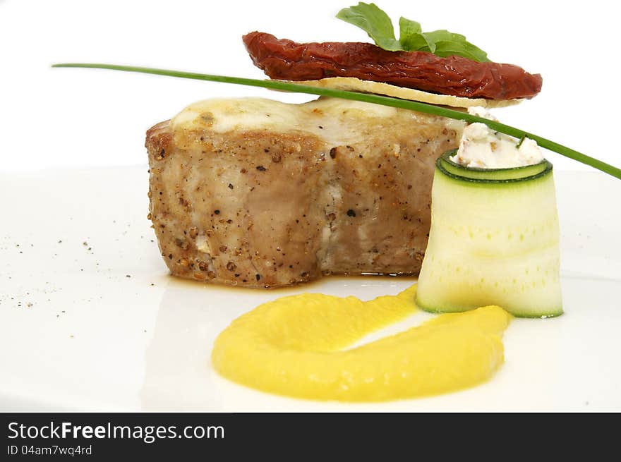 Roasted meat with mustard sauce on a white background. Roasted meat with mustard sauce on a white background