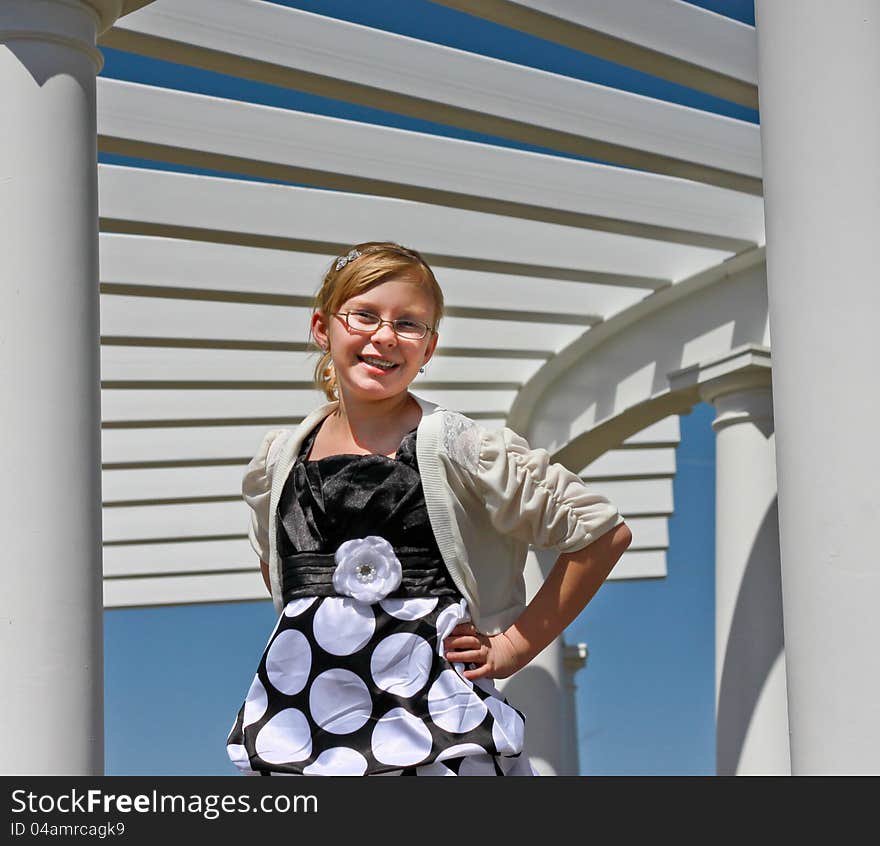 Image of a happy teen girl posing in a park