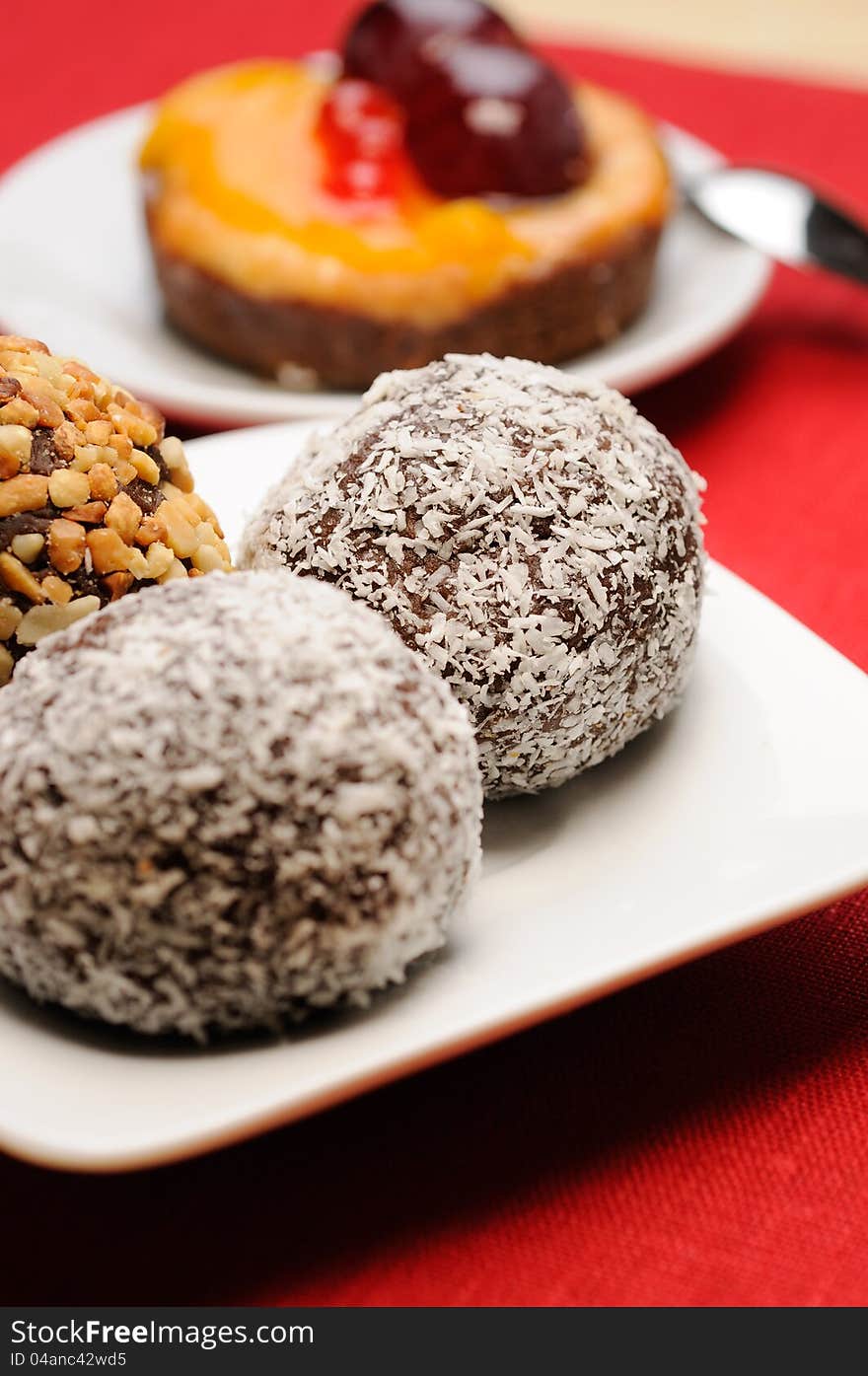 Chocolate cake with coconuts on the table. Selected focus