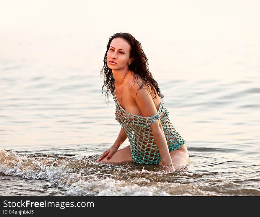 Seminude girl  in the sea