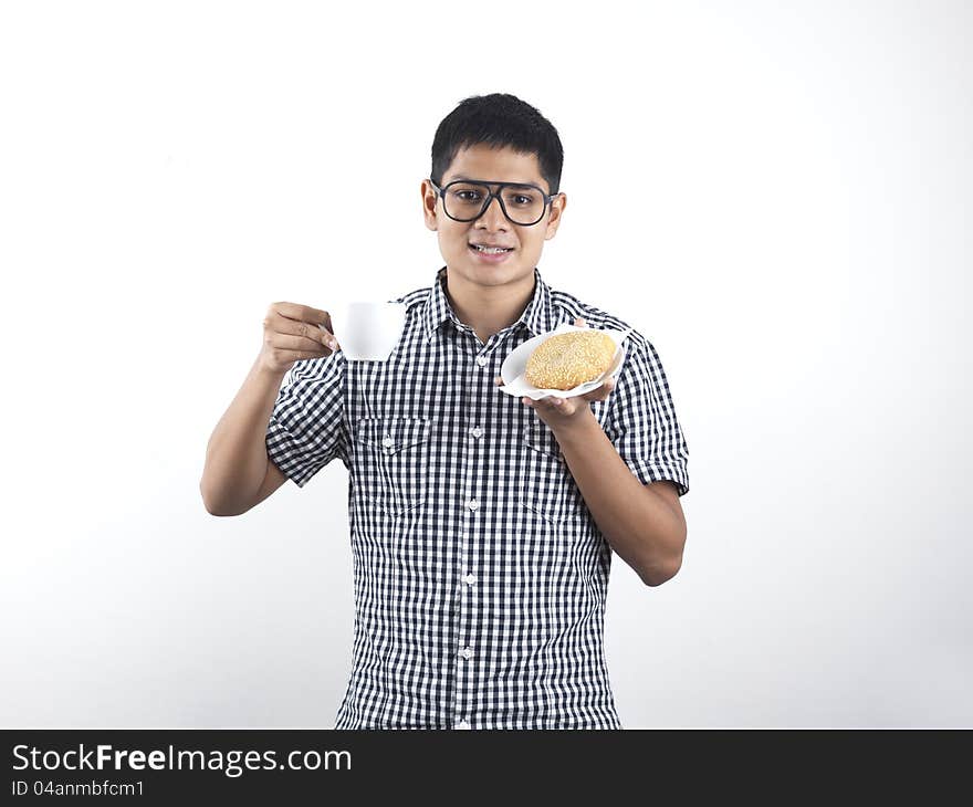 Indian Man Holding Asian Pastry And Cup