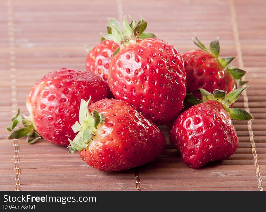 Strawberry wooden background close up