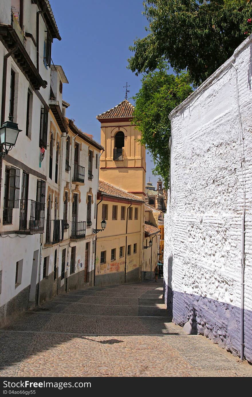 Old narrow street in Granada, Spain