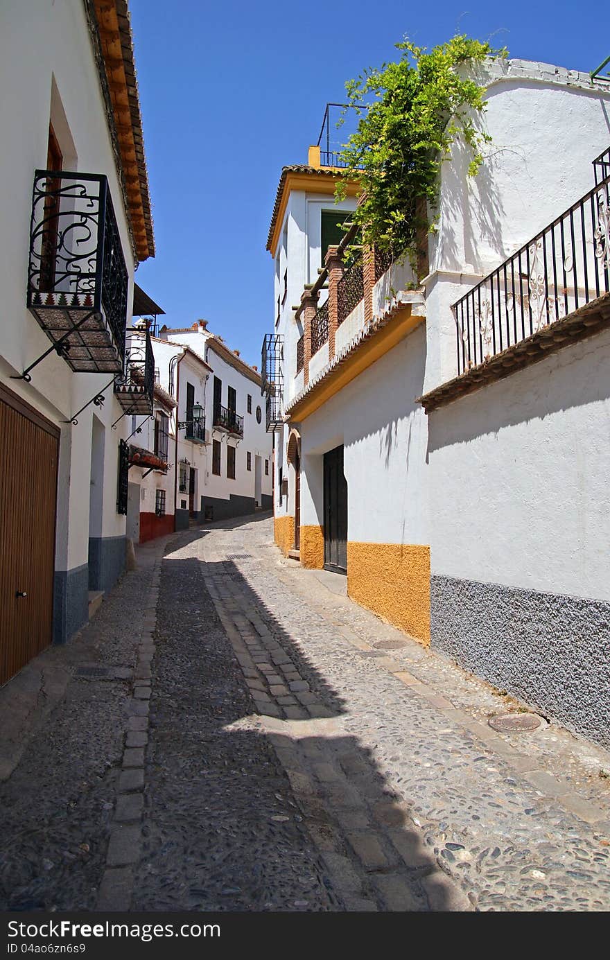 Old white buildings in Granada, Spain