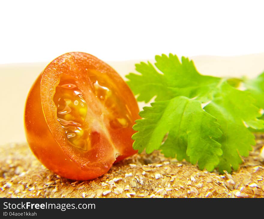 Half tomato on cracker with parsley