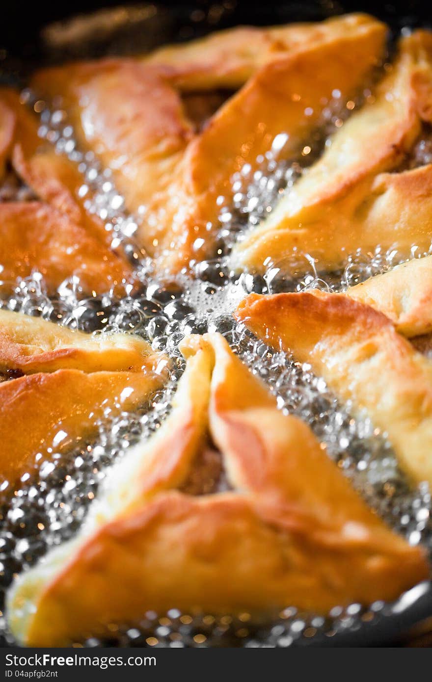 Pies in a frying pan closeup. Pies in a frying pan closeup