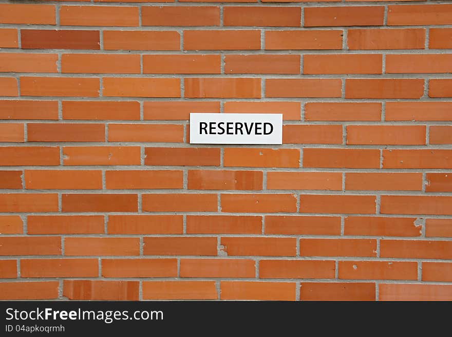 Brick wall with notification´s sheet - reserved