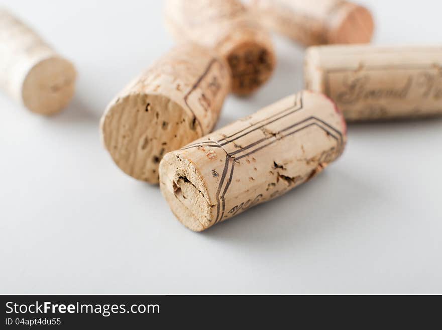 Group of wine corks on white background, shallow DOF. Group of wine corks on white background, shallow DOF