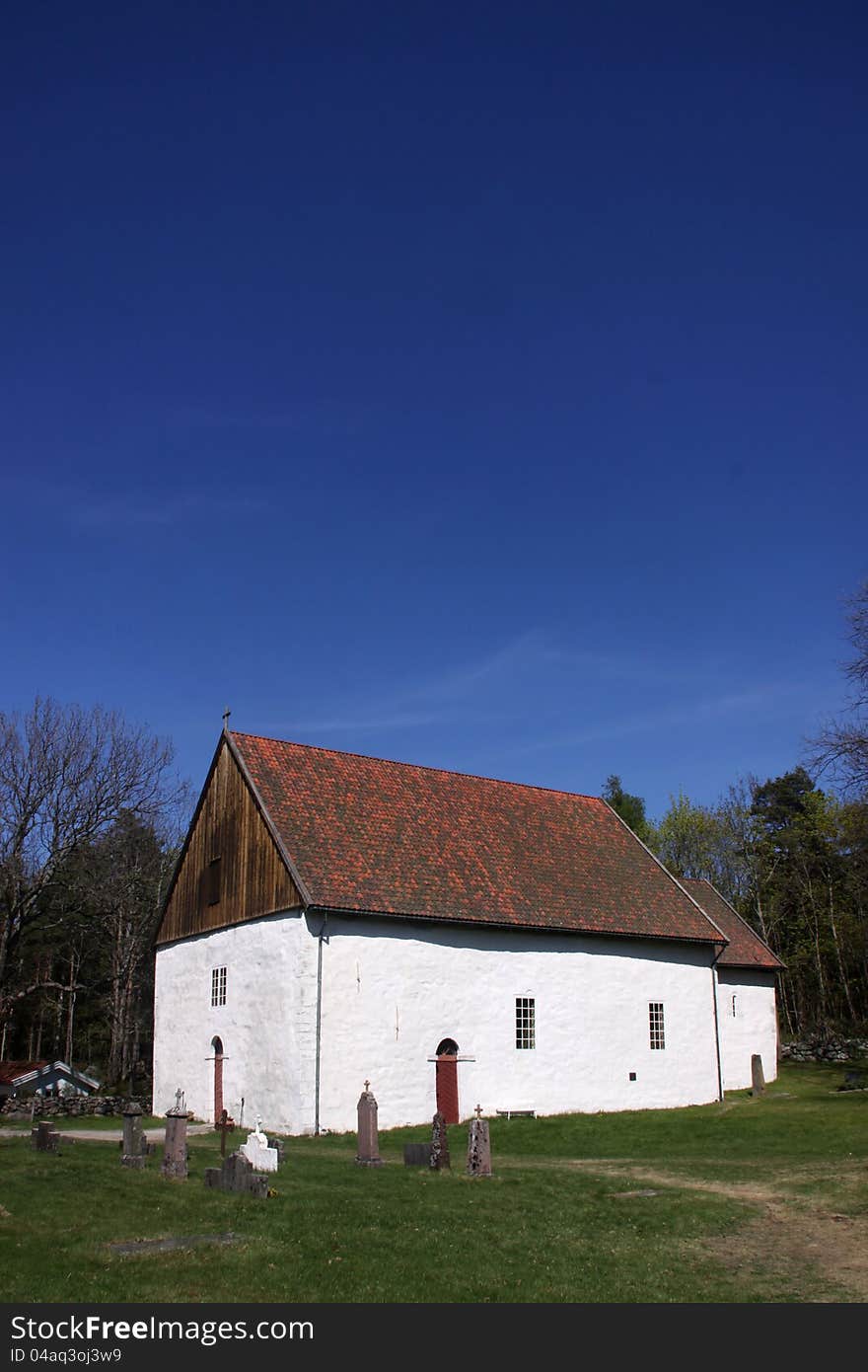 Romanesque simple white church with no tower. Romanesque simple white church with no tower