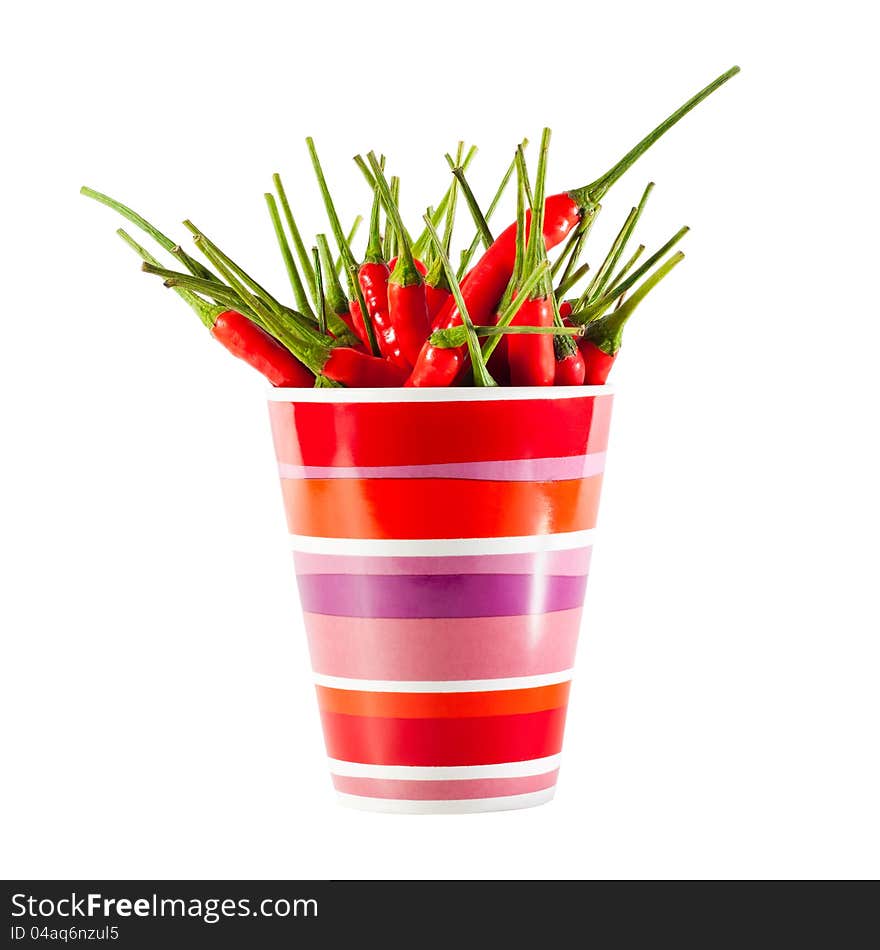 Red peppers in a mug isolated