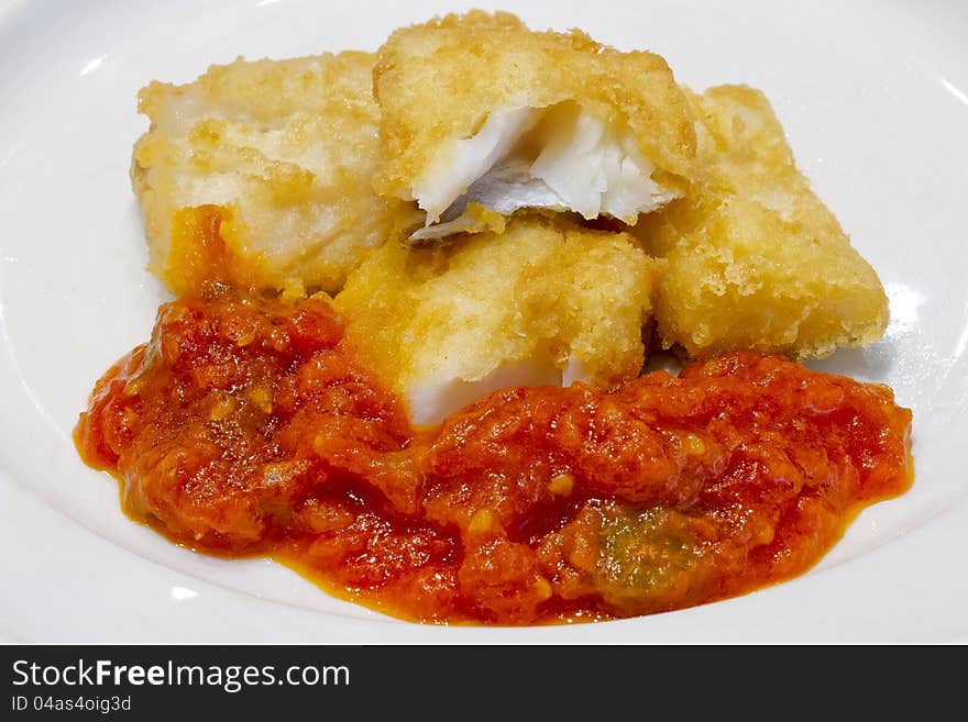 Fried Salted Codfish Ready For A Meal, With Tomato