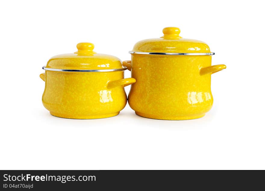 Two new yellow saucepans on white background. Clipping path is included