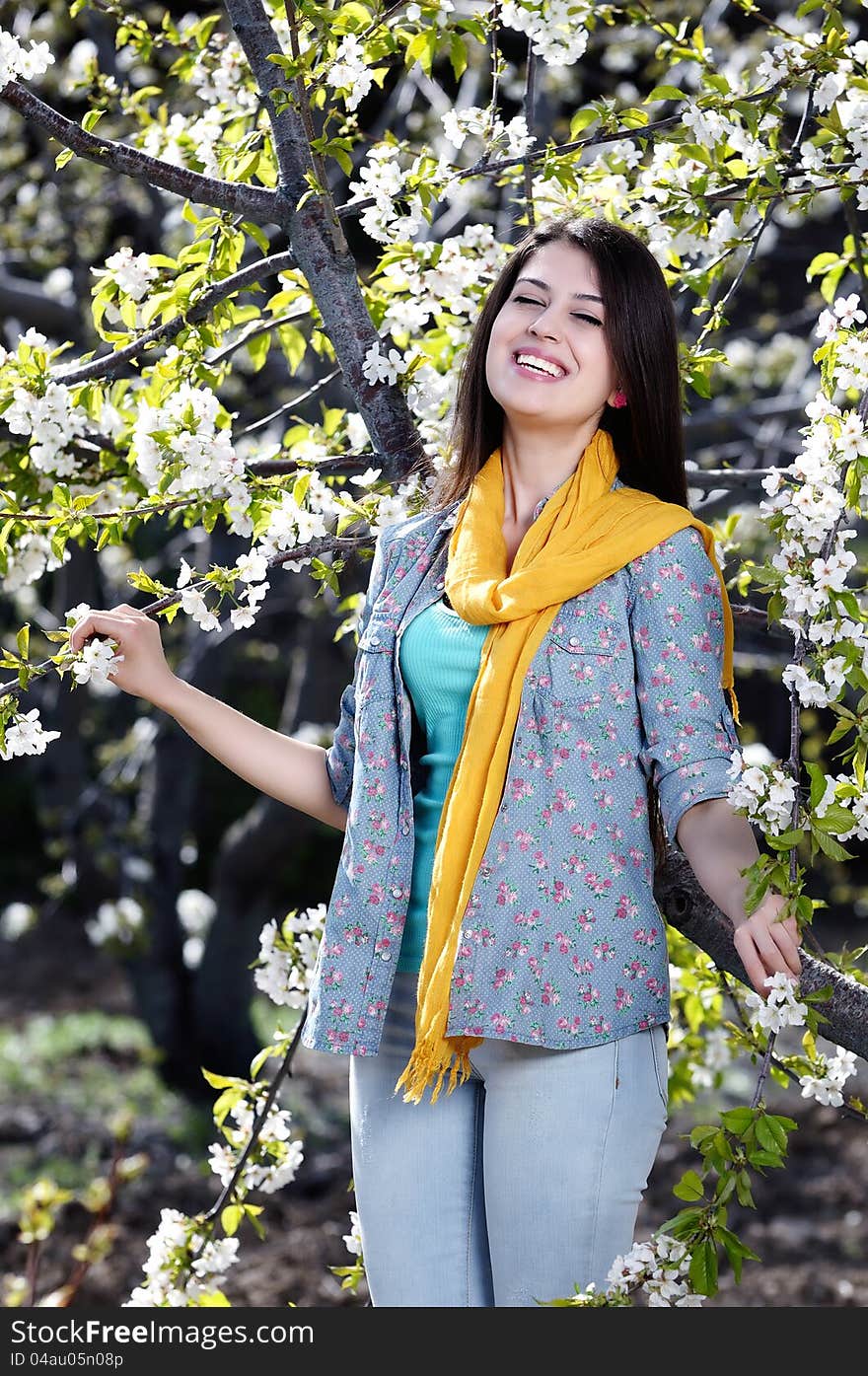 The image of a beautiful young woman was blossoming cherry orchard. cherry orchard with the integrated nature of young woman work photo. The image of a beautiful young woman was blossoming cherry orchard. cherry orchard with the integrated nature of young woman work photo.