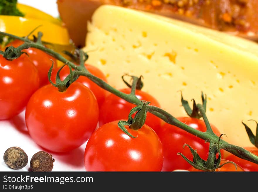 Background with cherry tomatoes, cheese and ham. Background with cherry tomatoes, cheese and ham