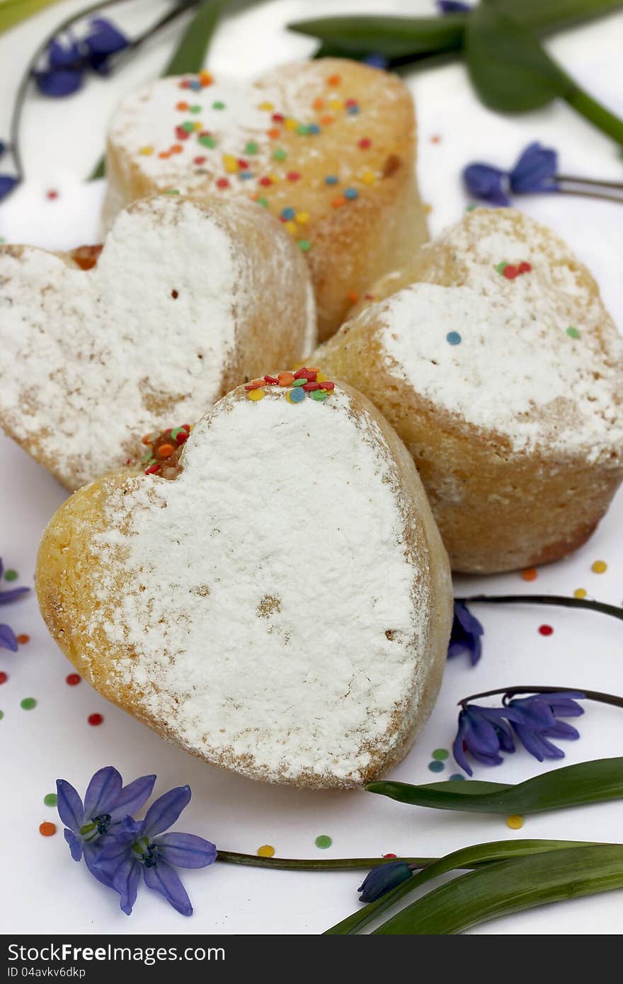 Little Easter cakes in the shape of hearts and flowers of spring. Little Easter cakes in the shape of hearts and flowers of spring