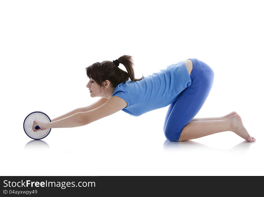 Girl with a gymnastic roller on  white background