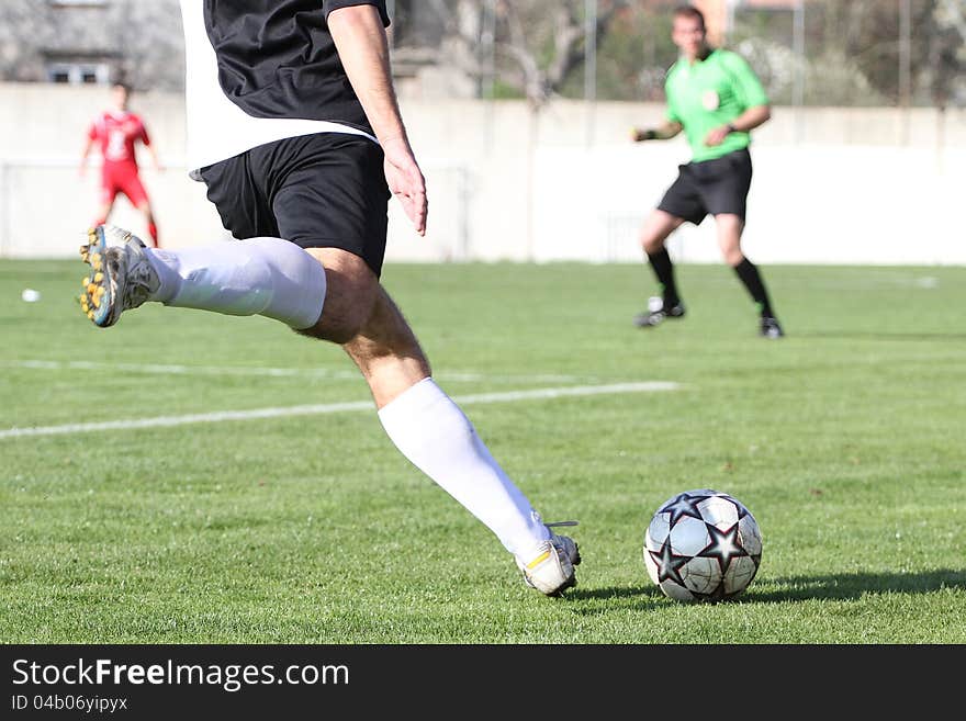 RIJEKA, CROATIA - APRIL 10: soccer match between NK Grobnican(red) and NK Opatija (black). Third Croatian Football League. April 10 2012 in Rijeka, Croatia. RIJEKA, CROATIA - APRIL 10: soccer match between NK Grobnican(red) and NK Opatija (black). Third Croatian Football League. April 10 2012 in Rijeka, Croatia