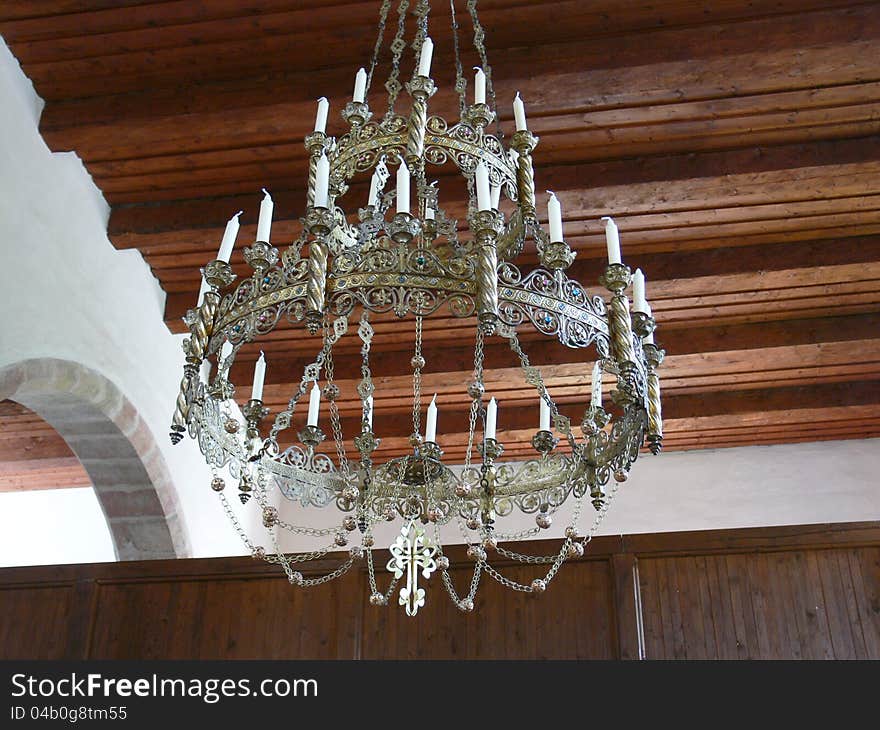 Hanging old ornamental chandelier in church