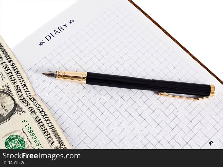 Diary with money and pen isolated on white background. Diary with money and pen isolated on white background